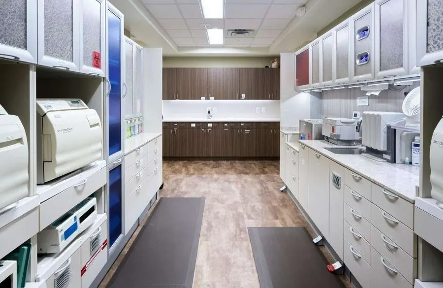 The sterilization center at Woodbury Dental Care, with autoclaves and instrument cabinets.